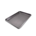 Metal baking tray on a white background