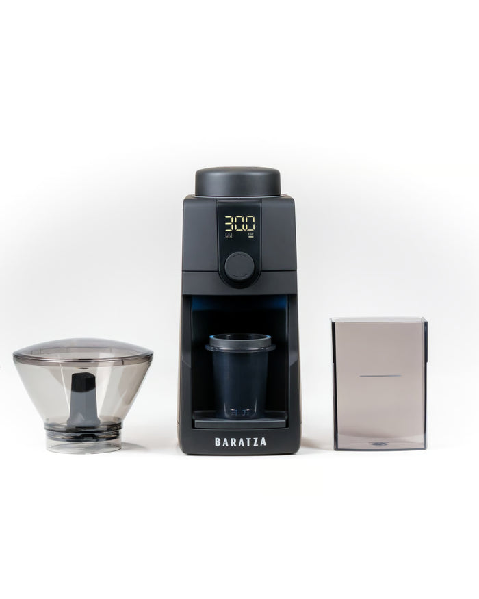 Baratza coffee grinder with a coffee hopper and packaging on a white background