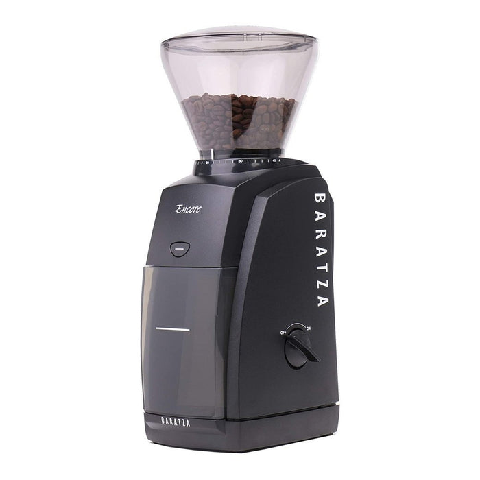Black Baratza coffee grinder with coffee bean filled bean hopper on a white background