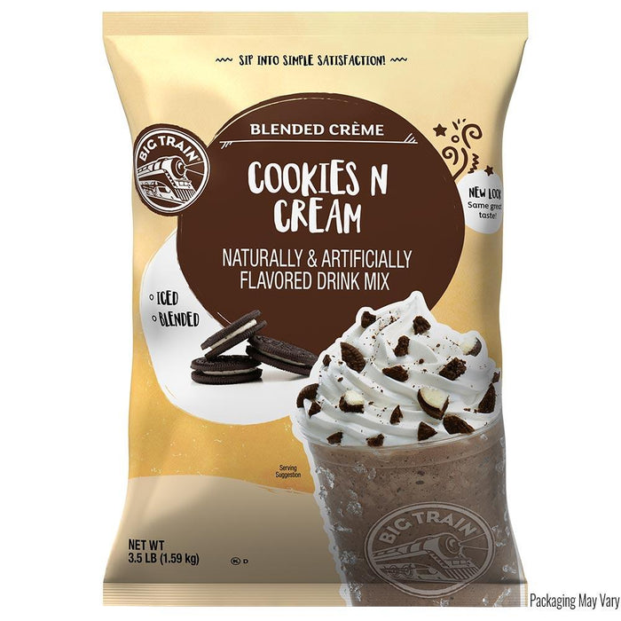Bag of Big Train Cookies 'N Cream drink mix with a chocolate milkshake and cookies on top.