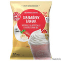 Bag of Big Train Strawberry Banana blended creme drink mix on a white background