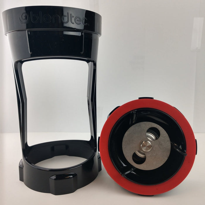 Blendtec blender jar with a red and black base on a white background