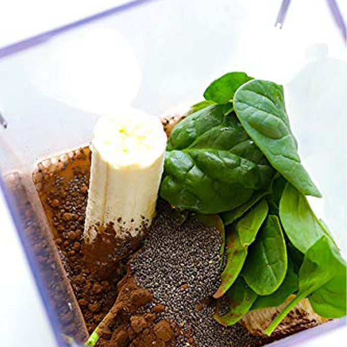 Close up of an assortment of food in a Blendtec blender
