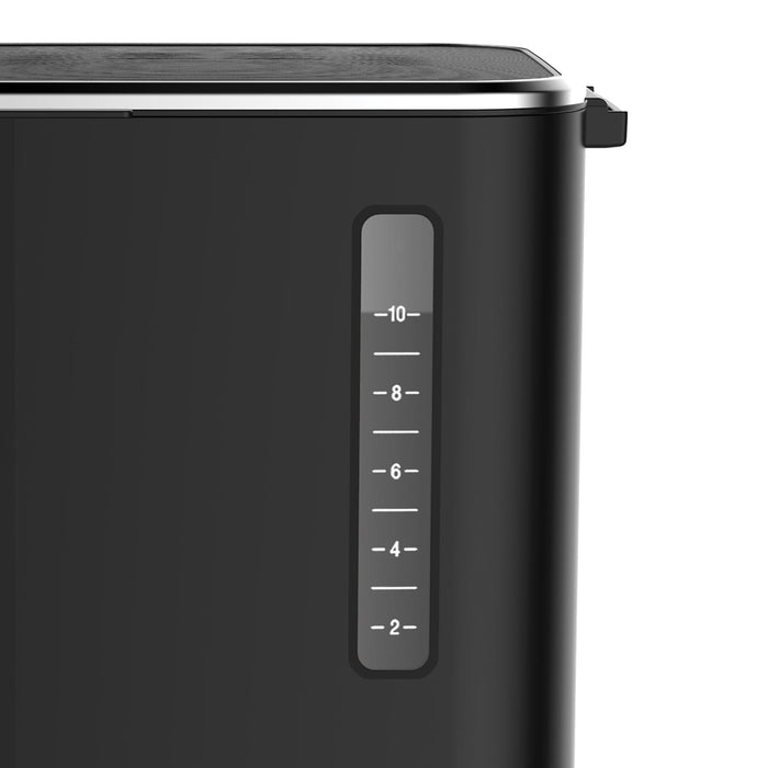 Black coffee maker with a water storage level container on a white background