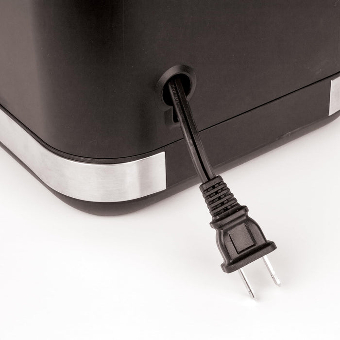 Black appliance with a power cord on a white background