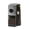 Capresso coffee grinder with coffee beans inside bean hopper and ground coffee inside clear container displayed on a white background