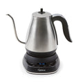 Stainless steel electric kettle with digital display on a white background