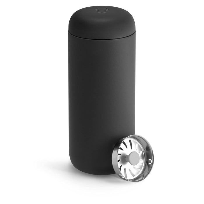 Matte black tumblr with a silver splash guard on a white background