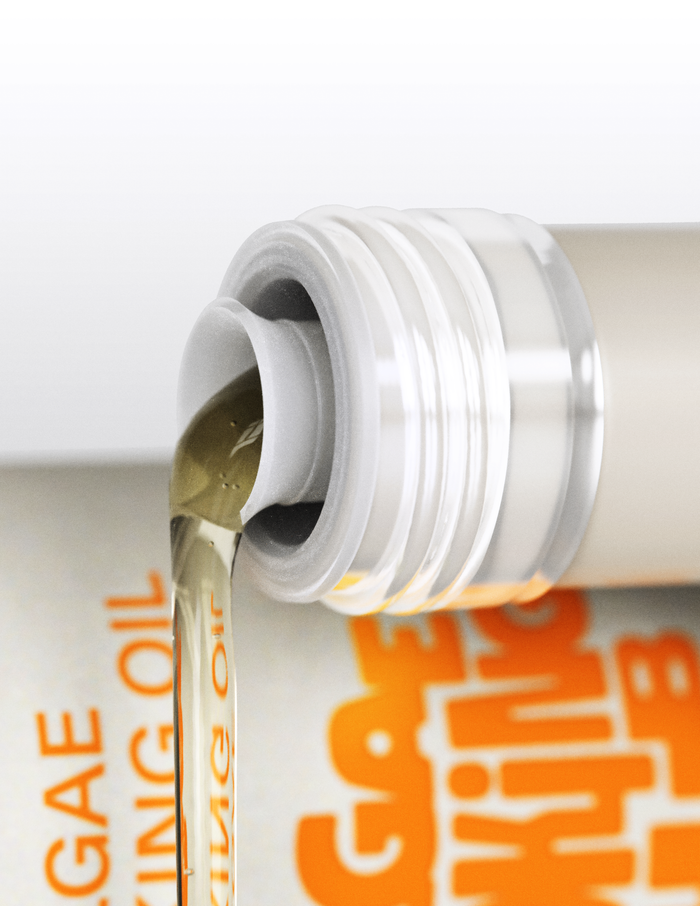 Close-up of a bottle cap with oil dripping, featuring text on a white background.