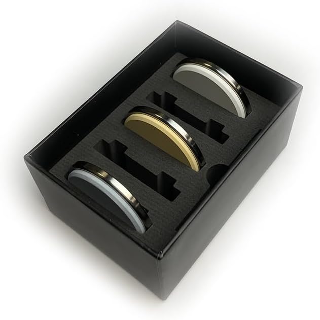 Three Grit Sharpening discs placed inside their package on a white background