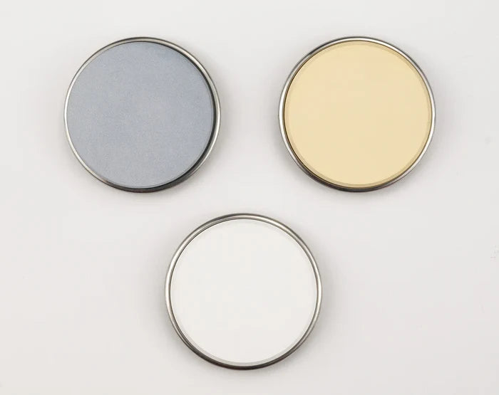 Three Grit Sharpening attachments on a light grey background