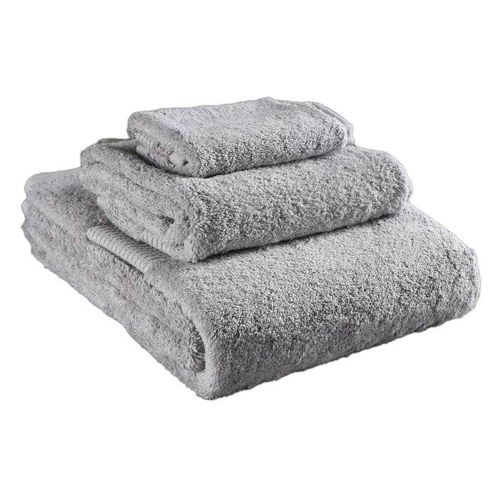 3 piece folded light grey Delilah Home 100 organic cotton bath towels displayed on a white background