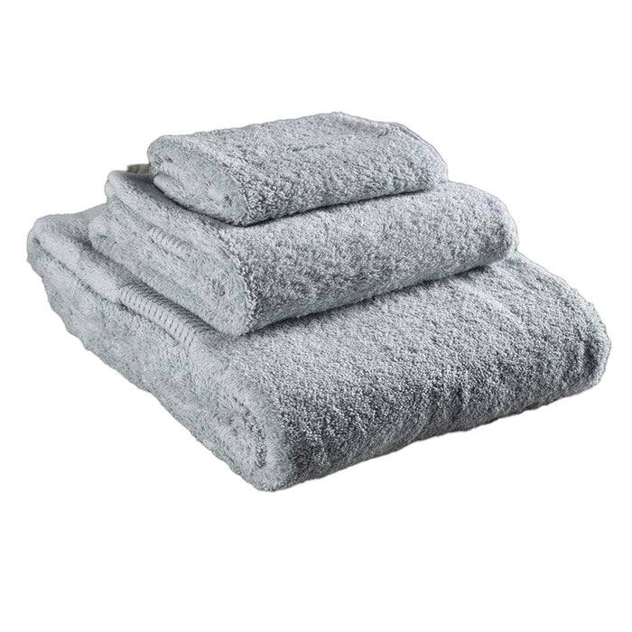 3 piece folded mineral green Delilah Home 100 organic cotton bath towels displayed on a white background