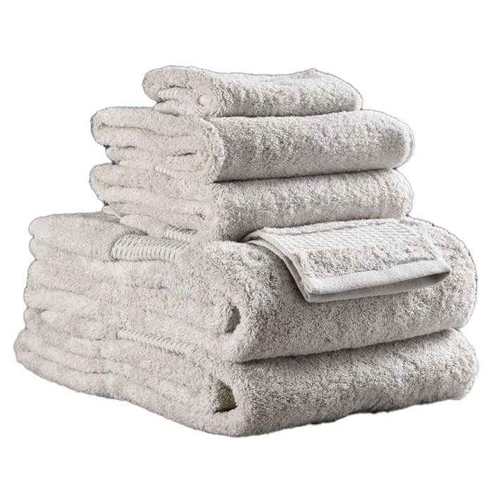 6 piece folded natural Delilah Home 100 organic cotton bath towels displayed on a white background