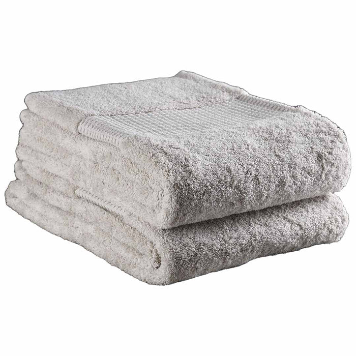 Set of 1 folded 36 x 72 natural Delilah Home 100 organic cotton bath towels displayed on a white background