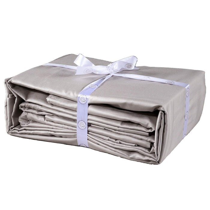 A folded slate gray twin XL Delilah home 100 organic cotton bed sheet set tied with a ribbon, on a white background.