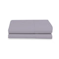 Folded light gray bed sheet on a white background