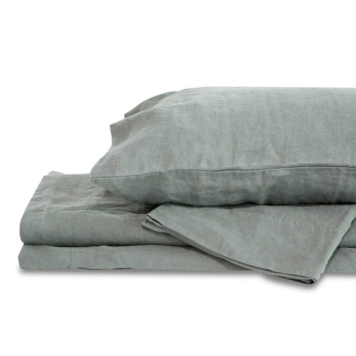 Set of gray bedding including a duvet and pillow on a white background