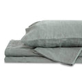 Set of gray bedding including a duvet and pillow on a white background
