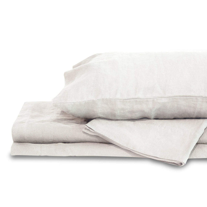 White queen Delilah home 100 organic hemp duvet cover folded on each other with a pillow on top displayed on a white background