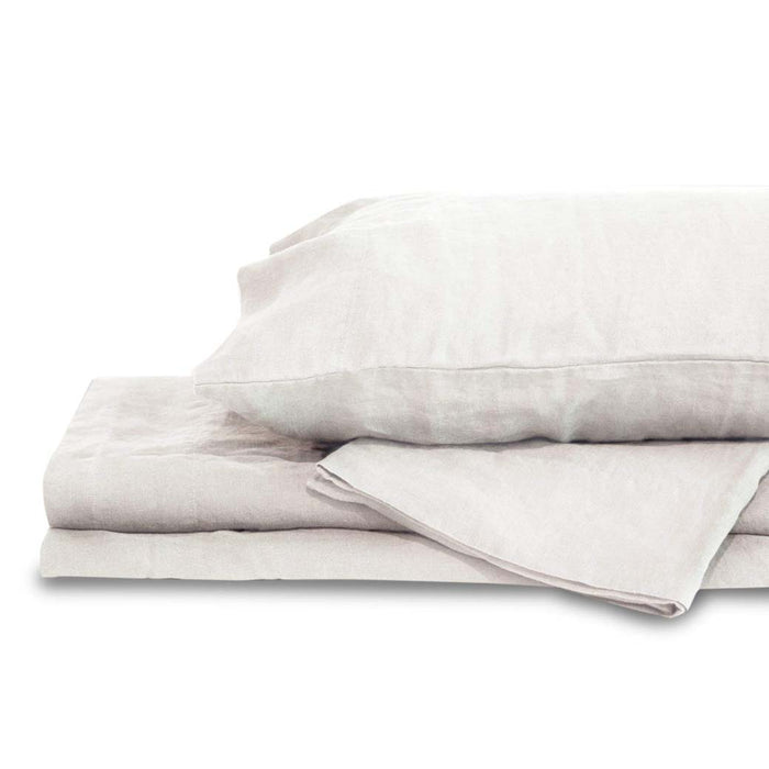 White king Delilah home 100 organic hemp duvet cover folded on each other with a pillow on top displayed on a white background