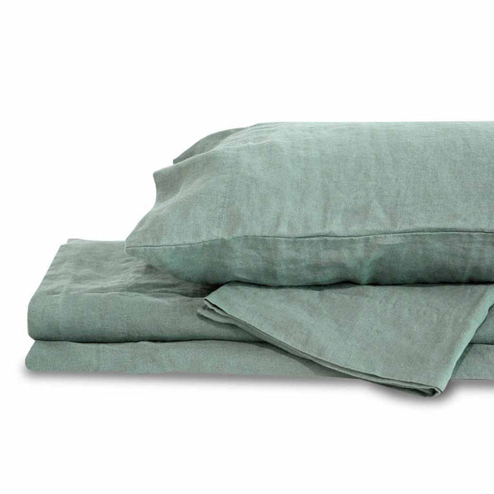 Mineral green queen Delilah home 100 organic hemp fitted sheet folded on each other with a pillow on top displayed on a white background