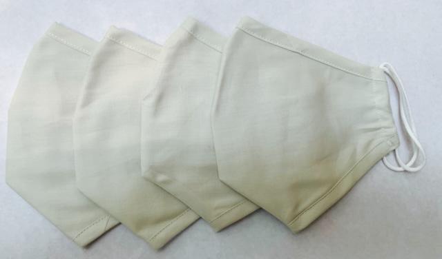 Set of 4 natural Delilah Home Essential 100% Organic Cotton Face Masks displayed on a white background