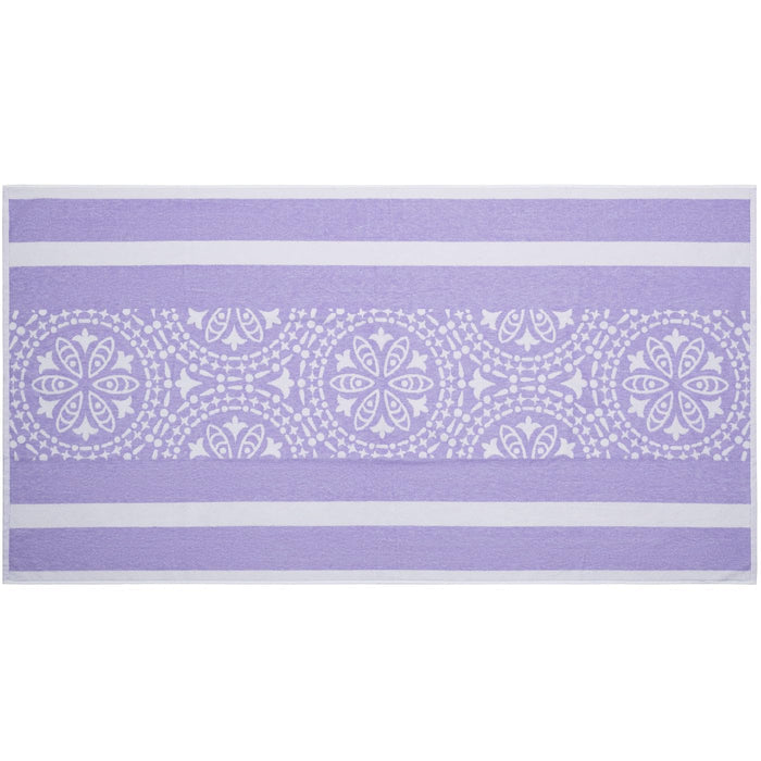 Purple towel with white geometric pattern on a white background