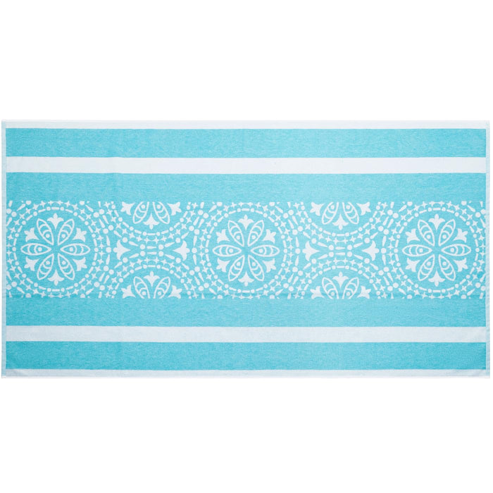 Teal towel with white geometric pattern on a white background