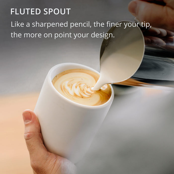 Person pouring milk into a cup of coffee with a fluted spout, text about design quality.