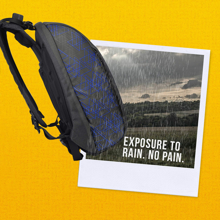 Side view of blue and black Eume backpack on a yellow background and polaroid with raining forest and text "Exposure To Rain. No Pain."
