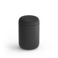 A 12 oz black Fellow Carter Everywhere Mug with a lid displayed on a white background