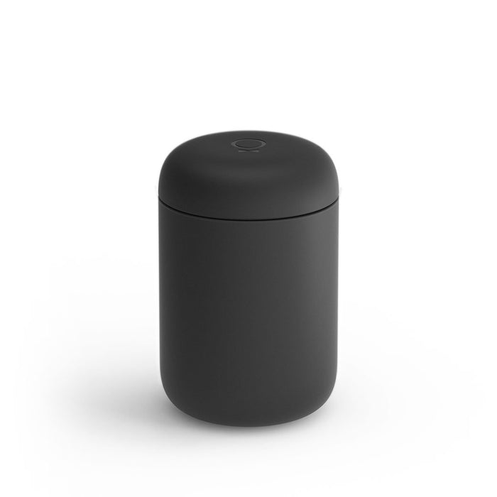A 12 oz black Fellow Carter Everywhere Mug with a lid displayed on a white background