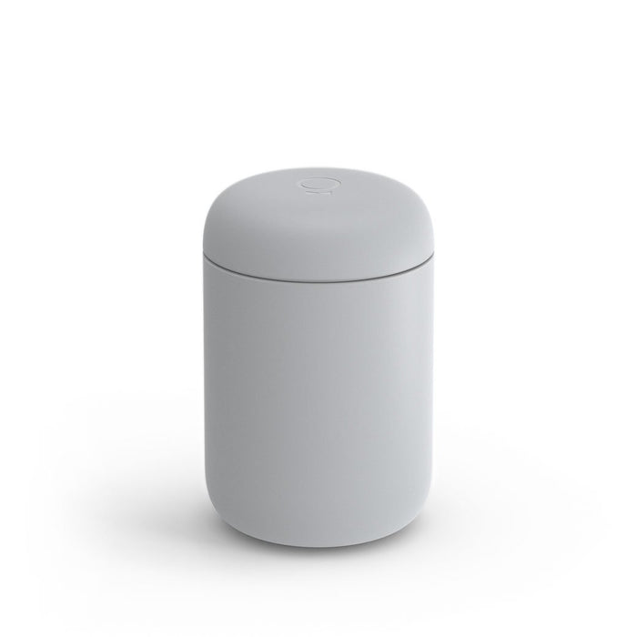 A 12 oz grey Fellow Carter Everywhere Mug with a lid displayed on a white background
