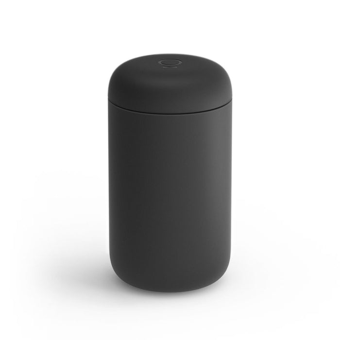 A 16 oz black Fellow Carter Everywhere Mug with a lid displayed on a white background