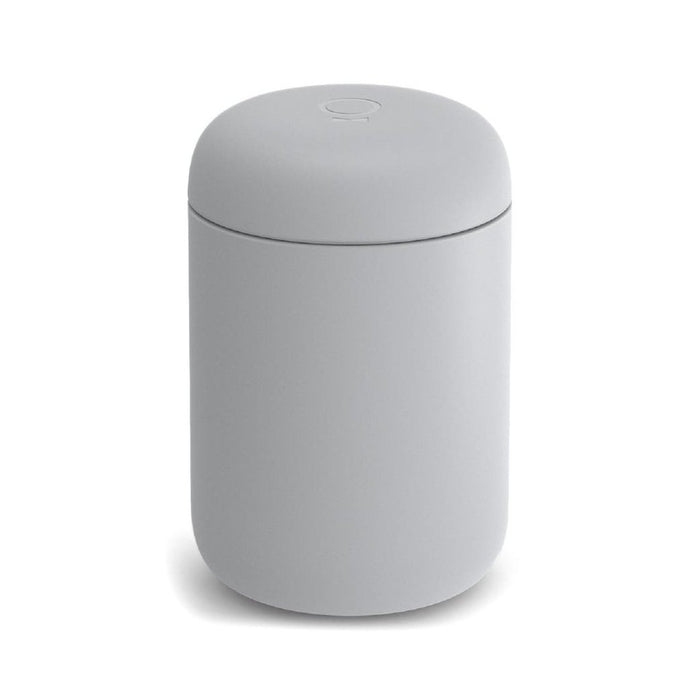 A 16 oz grey Fellow Carter Everywhere Mug with a lid displayed on a white background