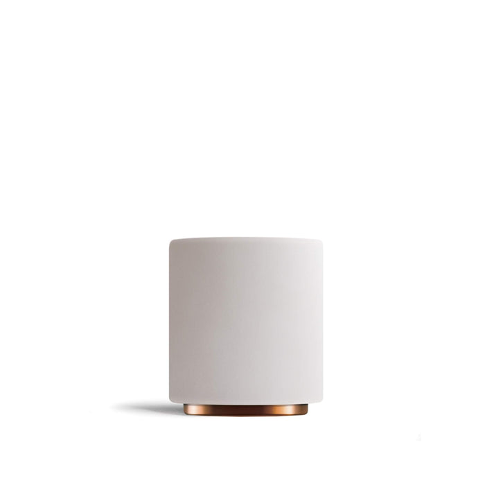White cup with copper base on a white background