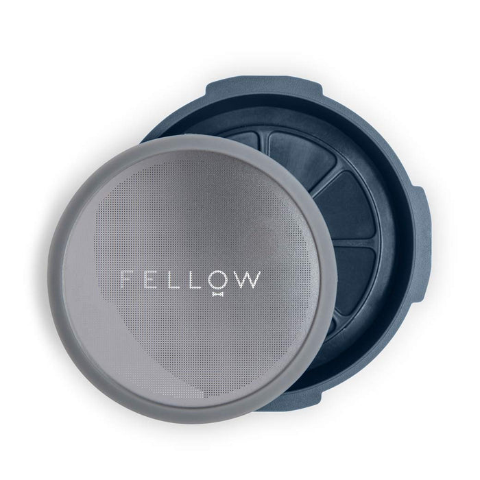 Gray and blue espresso machine accessories with 'Fellow' branding on a white background