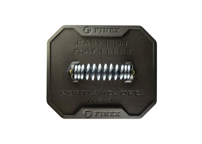 Top view of FINEX 8'' Cast Iron Grill Press displayed on a white background