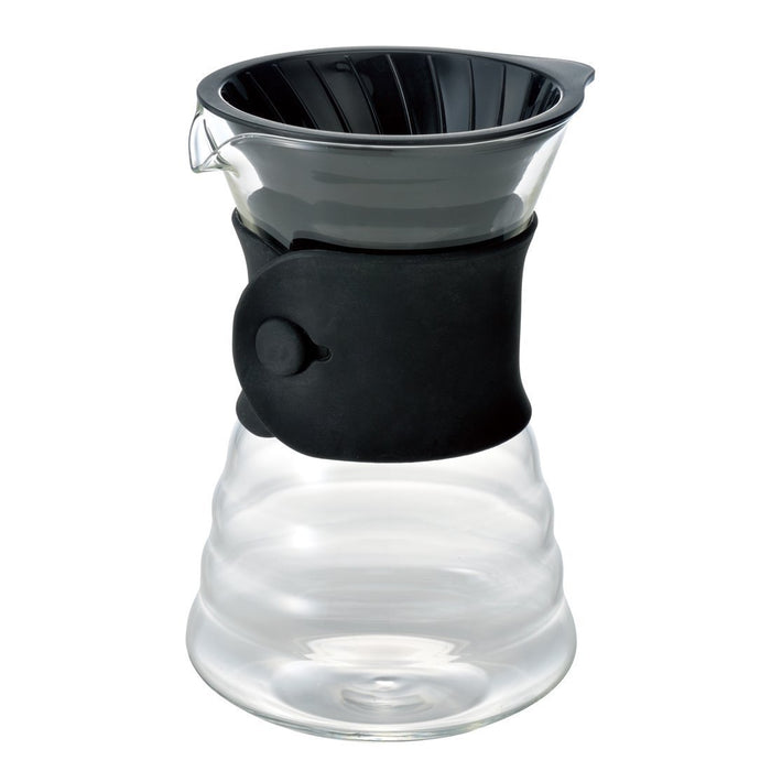 Clear glass drip decanter with black silicone sleeve on a white background