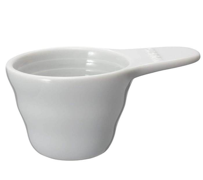 White Hario V60 ceramic measuring spoon displayed on a white background