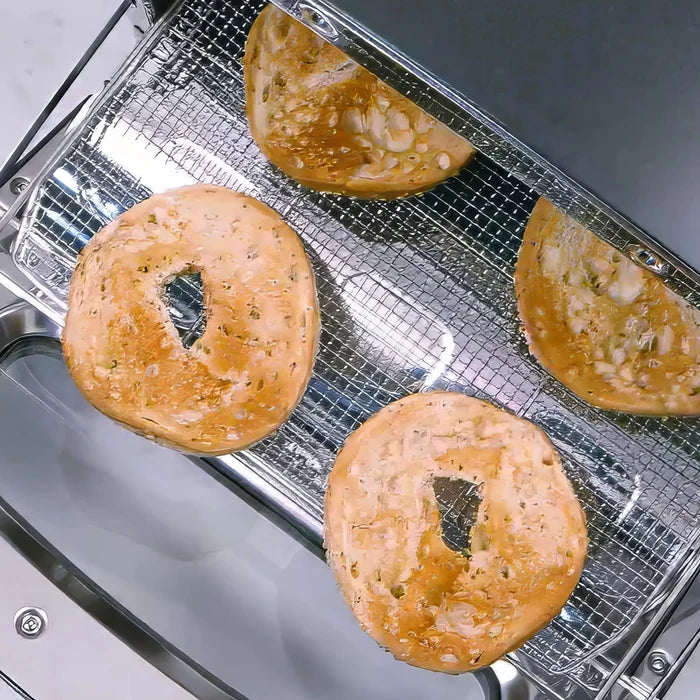 Bagels on a cooling rack inside a toaster oven