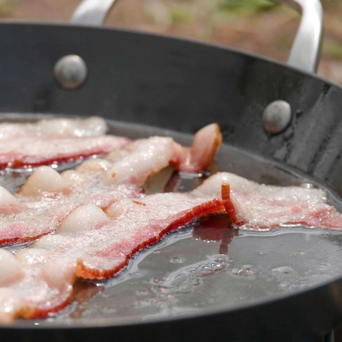 ICON griddle cooking bacon outside