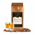 1 lb J.L. Hufford almond amaretto coffee package with two shot glasses, coffee beans, and almonds on a white background