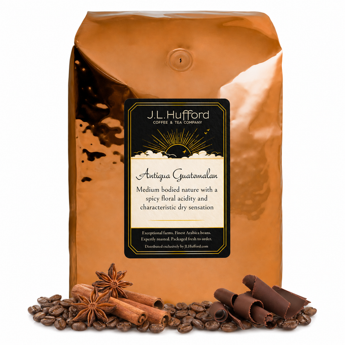 5 lb J.L. Hufford Antigua Guatemalan coffee bag with coffee beans, chocolate shavings and cinnamon sticks in front of the coffee bag