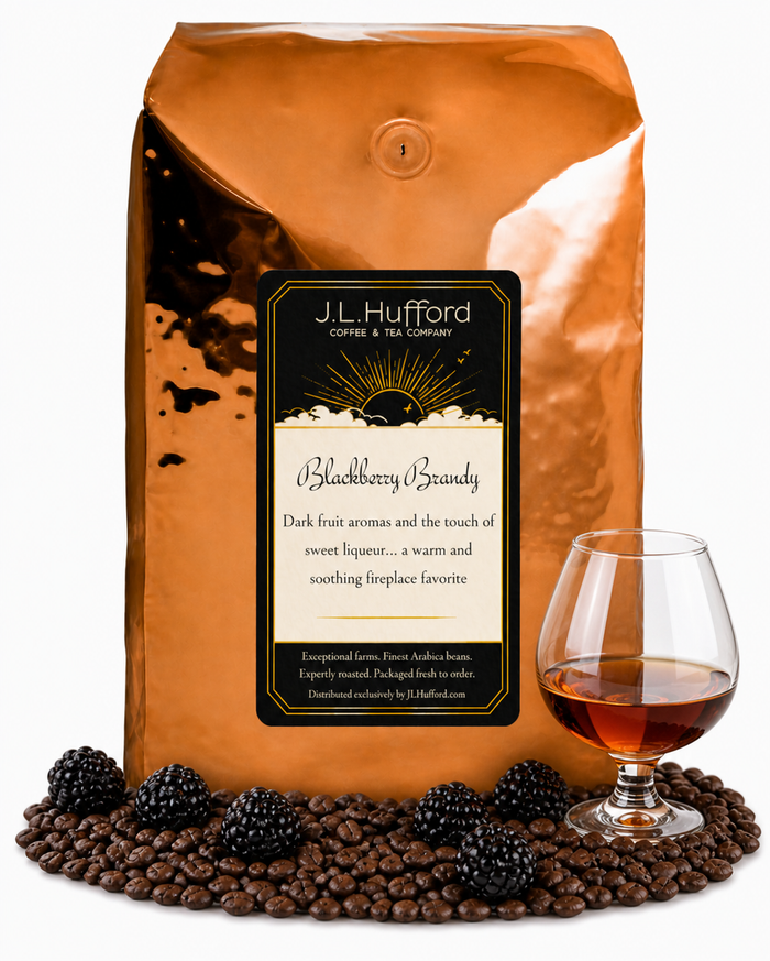 5 lb Blackberry Brandy coffee beans bag with coffee beans, blackberries and glass of brandy in front displayed on a white background
