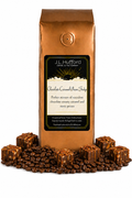 1 lb J.L. Hufford Chocolate Caramel Pecan Fudge Coffee with coffee beans and chocolate pecan fudge blocks drizzled with caramel in front displayed on a white background