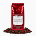 1 lb J.L. Hufford Chocolate Cherry Kiss coffee bag with coffee beans, chocolate bars, and cherries on a white background
