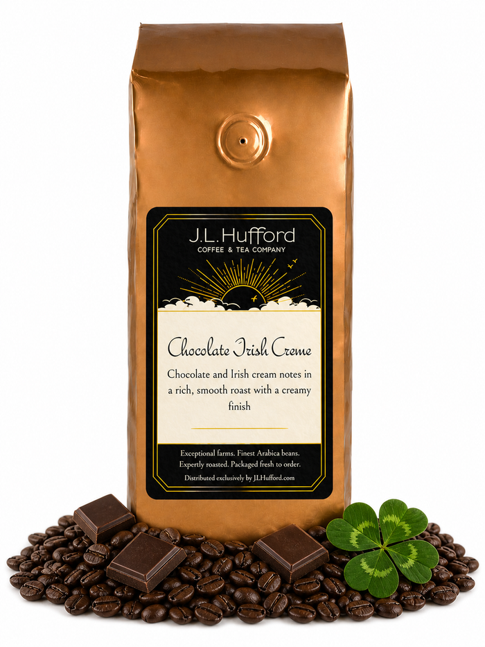 1 lb Chocolate Irish Creme coffee beans bag with coffee beans, blocks of chocolate, and four-leaf clover in front displayed on a white background