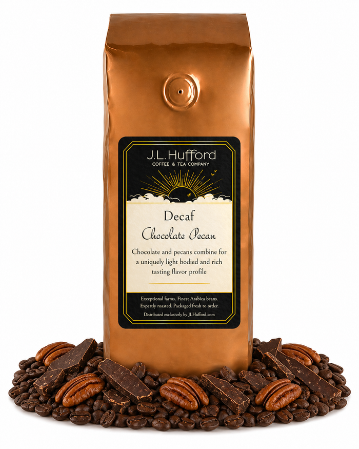 1 lb coffee bag labeled 'Decaf Chocolate Pecan' with chocolate pecan flavor, surrounded by coffee beans, chocolate, and pecans on a white background.
